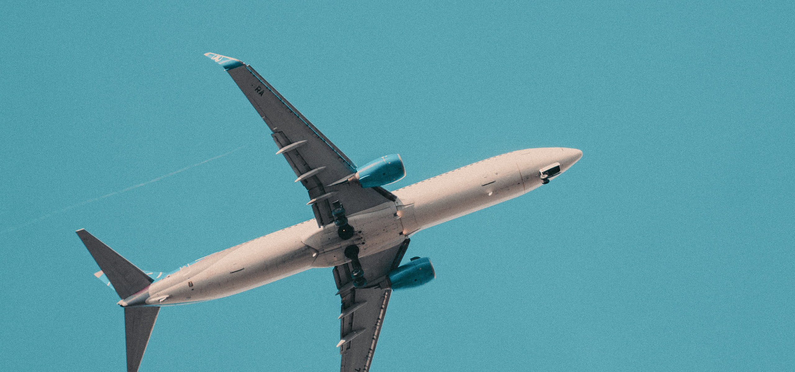 High-altitude aircraft flying towards a sustainable future, symbolizing the role of Sustainable Aviation Fuel (SAF) in reducing carbon emissions. Explore our whitepaper 'Fueling the Future of Aviation' for insights into SAF and alternative propulsion technologies.